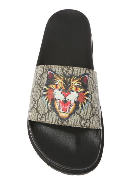 gucci sneakers tiger fake|Gucci tiger head slides.